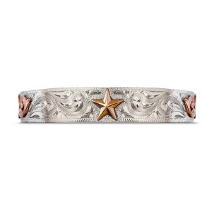 A silver cuff bracelet for men and women featuring a hand engraved pattern and a golden star figure 